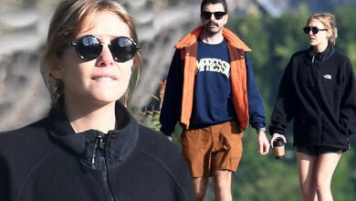 Photo of Elizabeth Olsen showcases her toned legs in shorts as she takes a romantic stroll in Los Angeles with husband Robbie Arnett